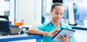 Medical professional using a tablet