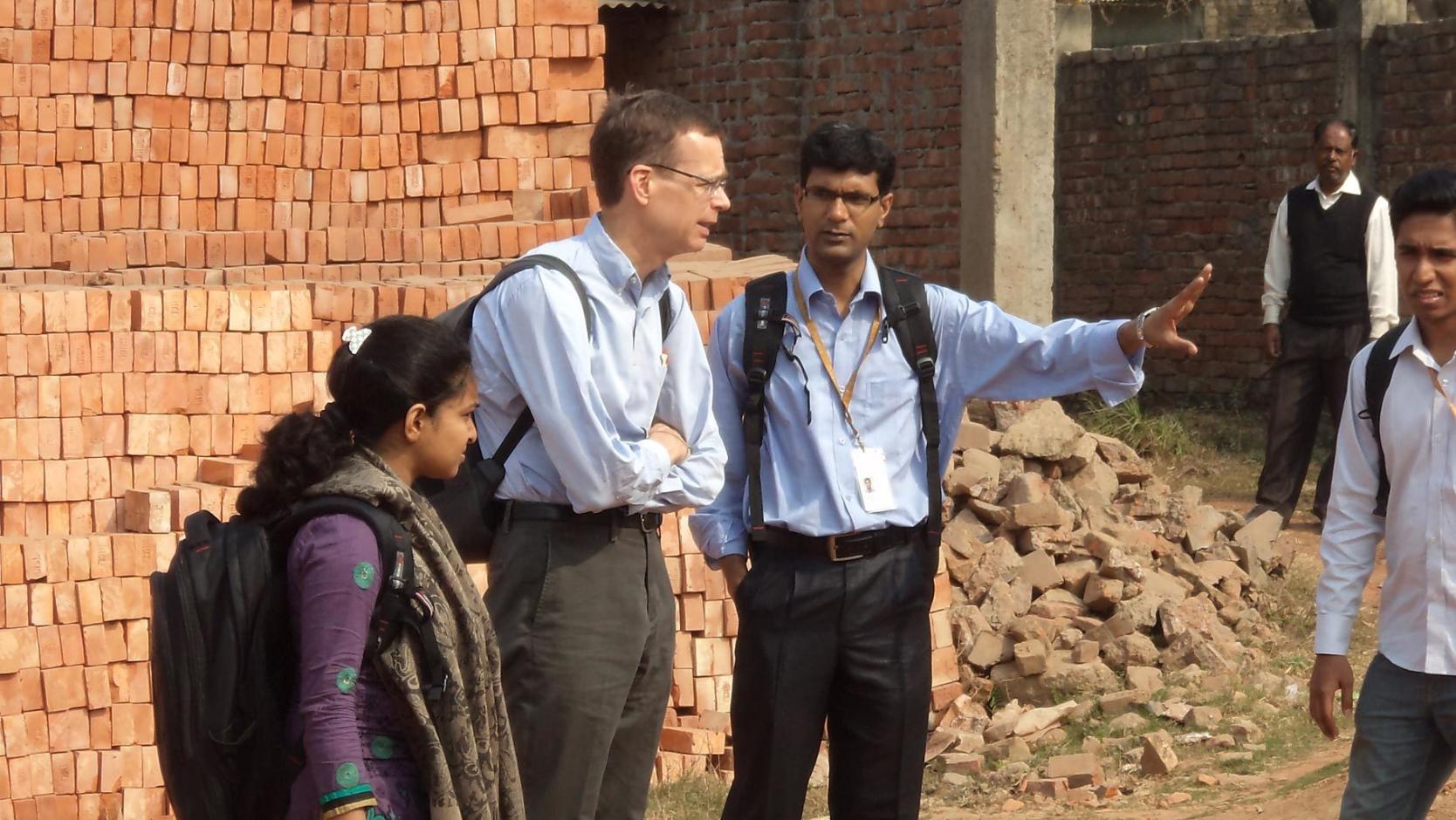 Debashish Biswas and Stephen Luby at a brick kiln in Bangladesh.