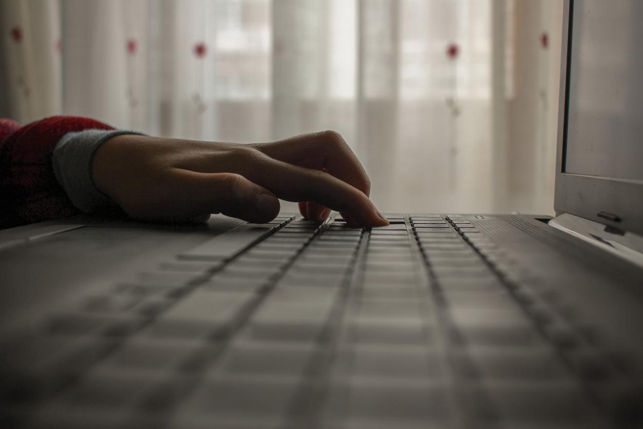 image of hands on a computer keyboard