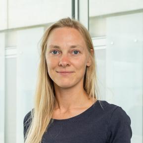 image of female with blonde hair wearing a black t-shirt