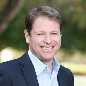 image of male wearing a blue suit, light blue shirt