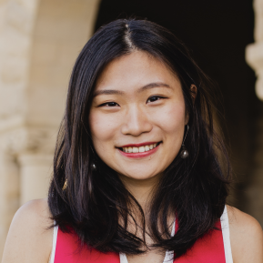 image of female with black hair wearing a red top