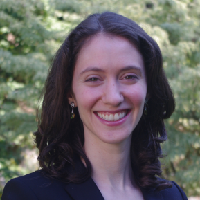 image of female with brown hair wearing a blue suit