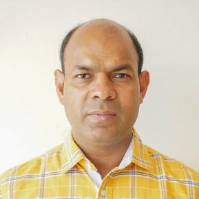 image of male wearing a yellow shirt