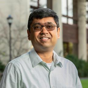 image of male wearing a green shirt with black hair