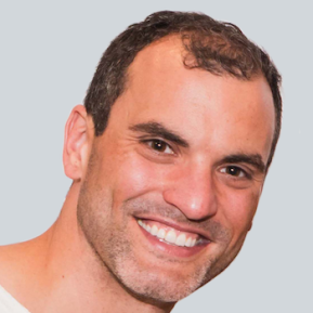 Image of male with brown hair wearing a white shirt