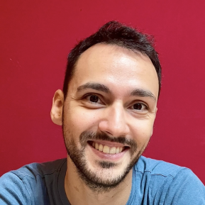 image of male with black hair wearing a blue shirt