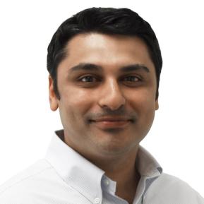 headshot of male with black hair wearing a white shirt