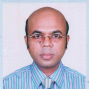 Headshot of a man with a bald head and wearing glasses. He is dressed in a striped shirt with shades of blue and pink and a light-colored tie. The background is a light blue. The man has a serious expression and is looking directly at the camera.