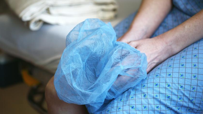 image of person holding a hair net