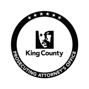 Black and white circular logo with graphic of MLK