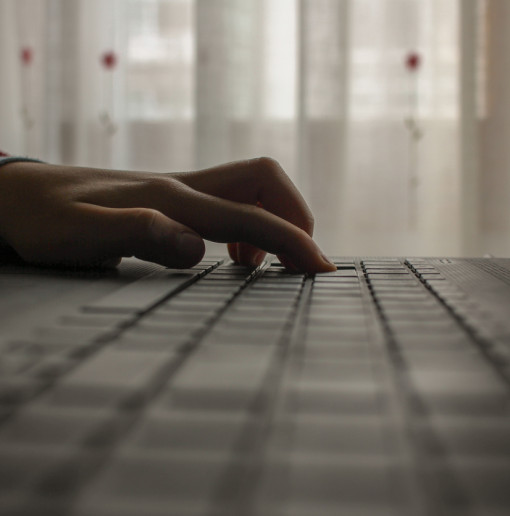 image of hands on a computer keyboard
