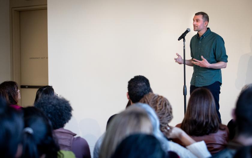 Duncan Lawrence on stage with a mic