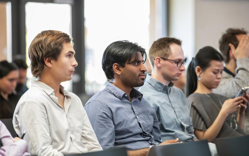 people in a classroom paying attention